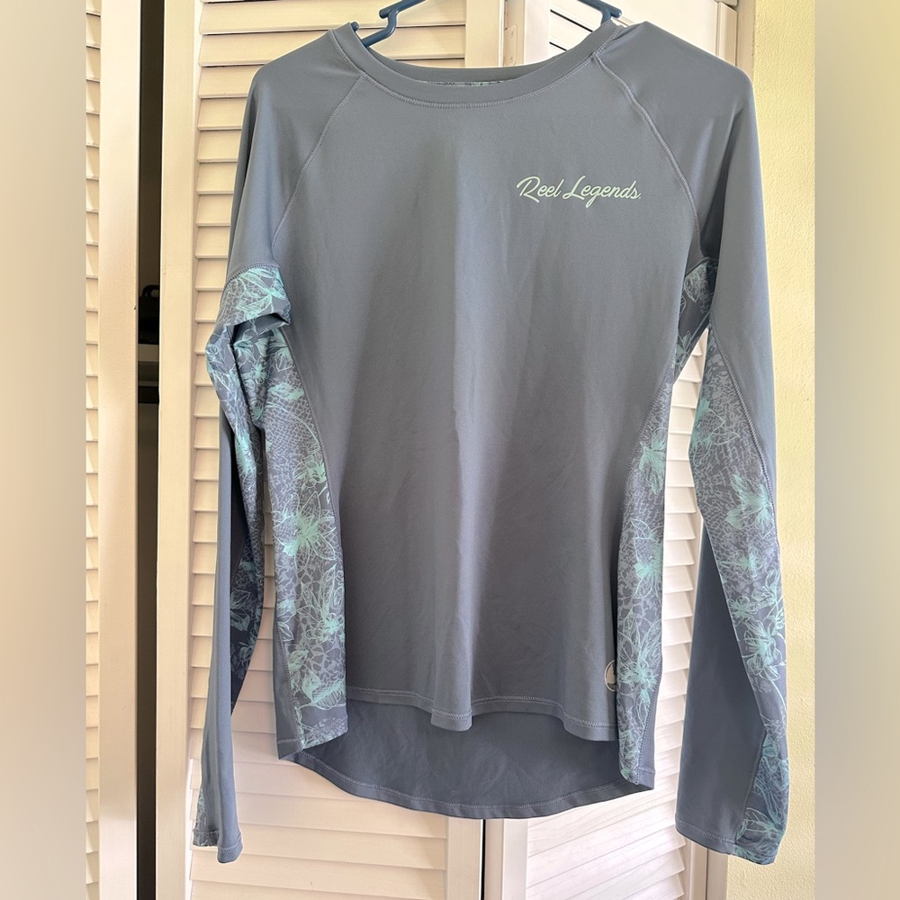 Woman’s Reel Legends fishing long sleeve shirt.